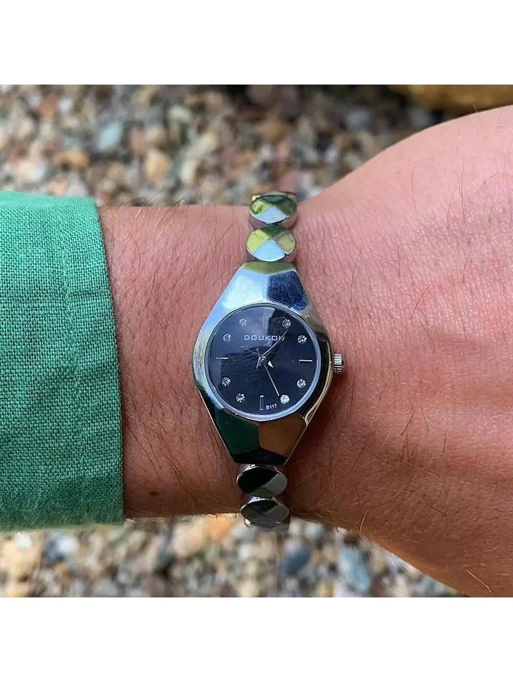Black and silver watch with a unique design with rhinestones